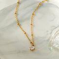 KADIRI Gold:  Solitaire Zirconia Charm Pendant on a Beaded Chain Necklace